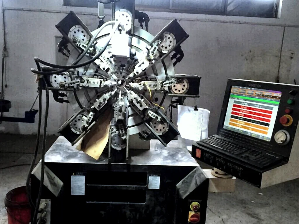 Round spring forming line for precision coil spring manufacturing