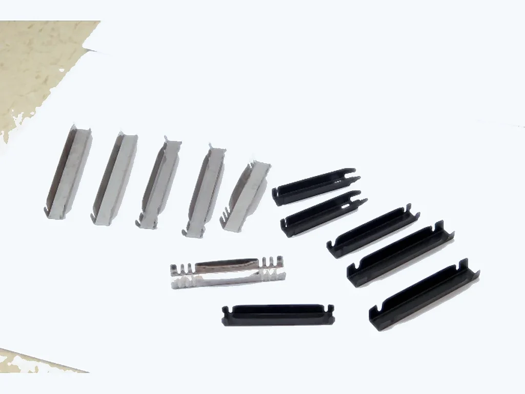 Small stamped spring components for precision manufacturing